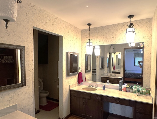 10059 Quince Rd, Plymouth, IN 46563 - full bathroom featuring toilet, vanity, and ensuite bathroom