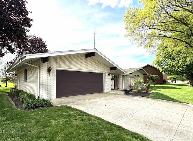 10059 Quince Rd, Plymouth, IN 46563 - ranch-style home featuring brick siding, an attached garage, a front lawn, and concrete driveway