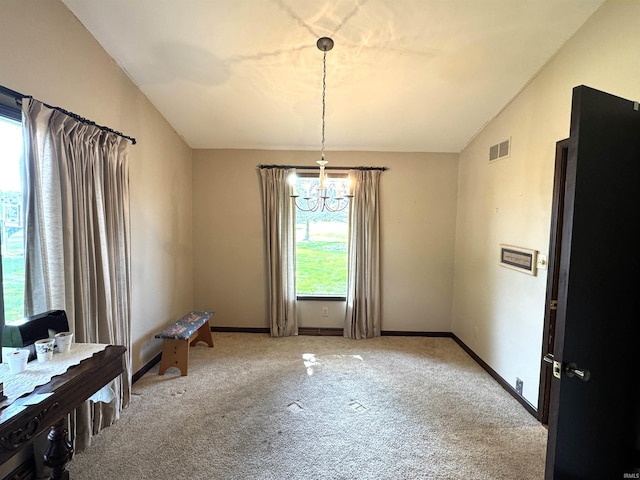 10059 Quince Rd, Plymouth, IN 46563 - dining room with a chandelier, light colored carpet, and baseboards