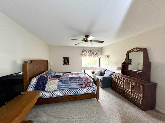 bedroom featuring light carpet and ceiling fan