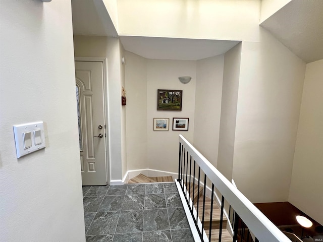 stairs featuring baseboards