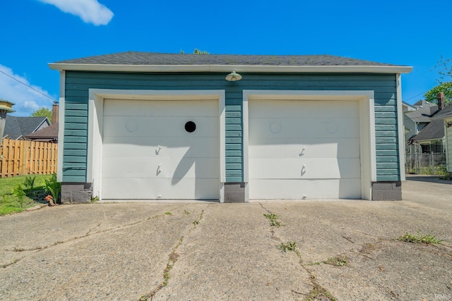 garage with fence