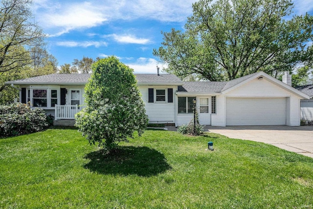 13840 Day Rd, Mishawaka, IN 46545 - split level home featuring a garage, concrete driveway, and a front lawn