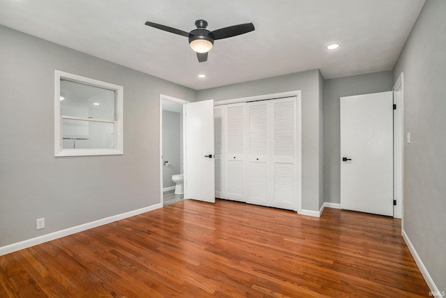 13840 Day Rd, Mishawaka, IN 46545 - unfurnished bedroom with baseboards, wood finished floors, a closet, and recessed lighting