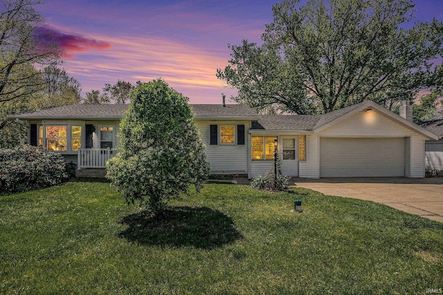 13840 Day Rd, Mishawaka, IN 46545 - tri-level home with a garage, a lawn, and driveway