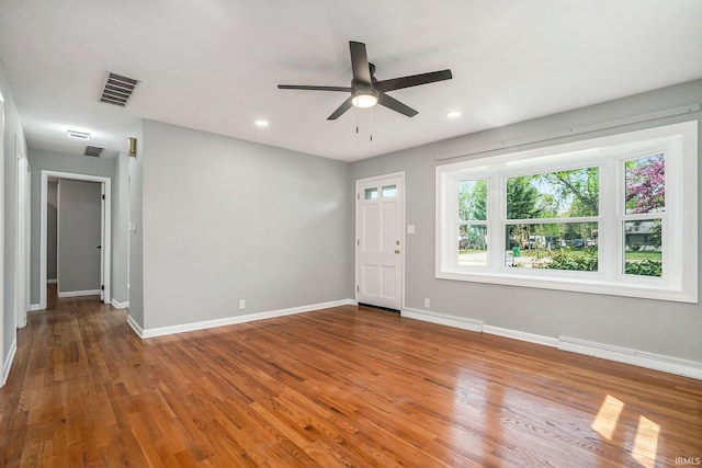 13840 Day Rd, Mishawaka, IN 46545 - spare room featuring a ceiling fan, baseboards, recessed lighting, and wood finished floors