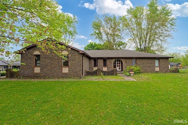 view of front of home featuring a front yard and brick siding