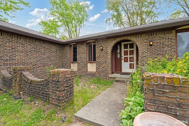 property entrance with brick siding