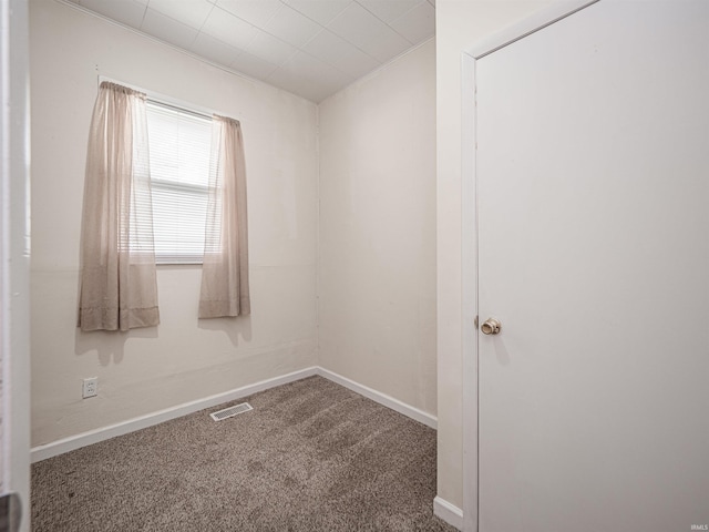 spare room with carpet flooring and baseboards