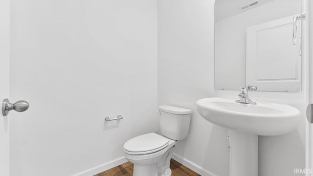8180 Carlie Ct, Fort Wayne, IN 46818 - bathroom with wood finished floors and toilet