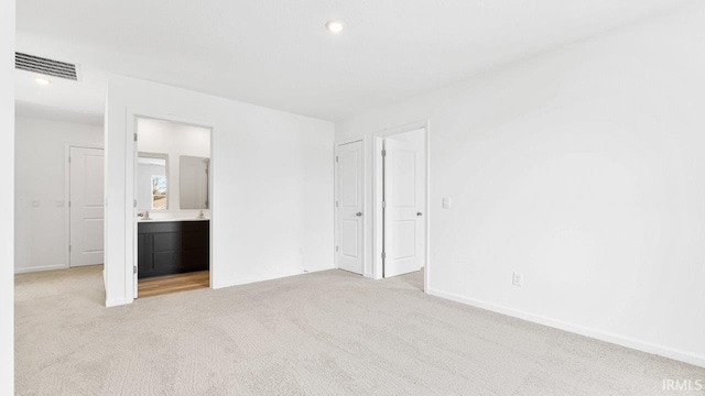 8180 Carlie Ct, Fort Wayne, IN 46818 - unfurnished bedroom with carpet floors, connected bathroom, and recessed lighting