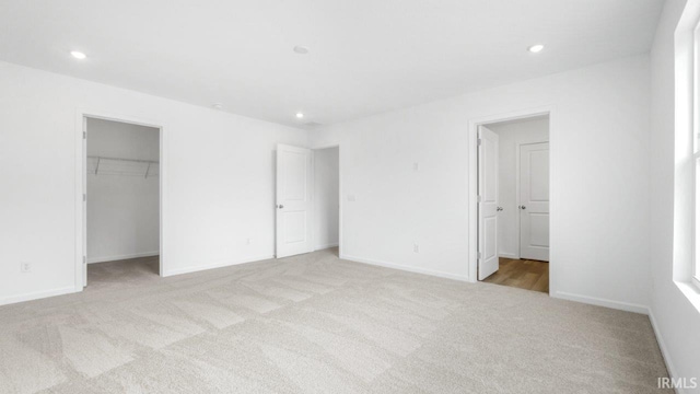 8180 Carlie Ct, Fort Wayne, IN 46818 - unfurnished bedroom with carpet flooring, a spacious closet, and recessed lighting