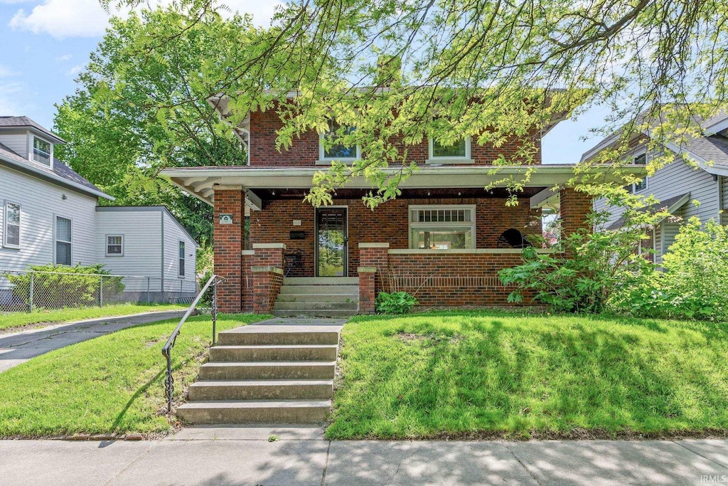 609 S 9th St, Lafayette, IN 47905 - traditional style home with a porch and brick siding