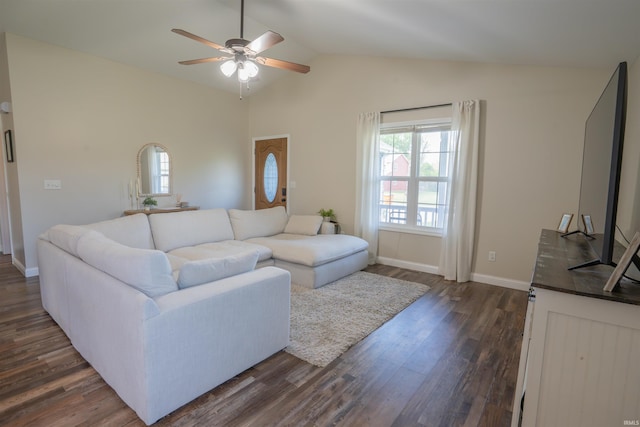 living room with a ceiling fan, dark wood finished floors, vaulted ceiling, and baseboards