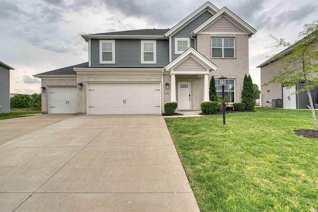 5783 Brookstone Dr, Newburgh, IN 47630 - view of front of property featuring brick siding, driveway, a front lawn, central AC, and an attached garage