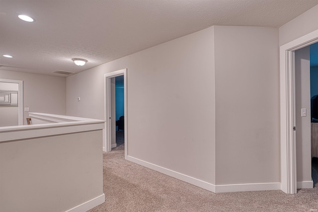 5783 Brookstone Dr, Newburgh, IN 47630 - hallway with light colored carpet, recessed lighting, baseboards, and a textured ceiling