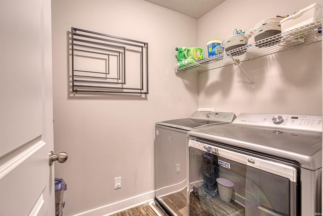 5783 Brookstone Dr, Newburgh, IN 47630 - laundry area with independent washer and dryer, baseboards, and dark wood-type flooring