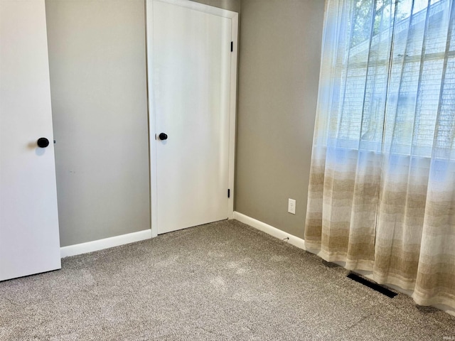 1719 Linwood Dr, Bedford, IN 47421 - unfurnished bedroom with carpet, baseboards, and a closet