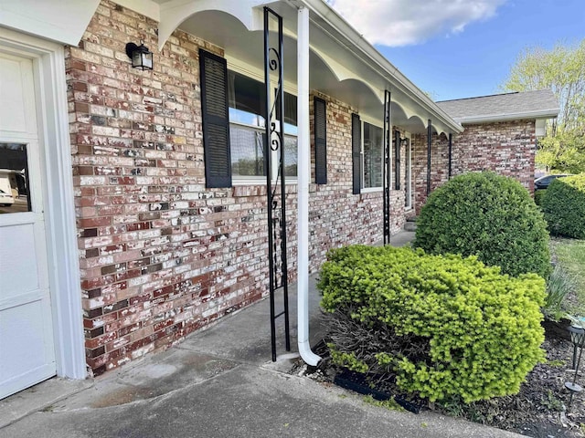 1719 Linwood Dr, Bedford, IN 47421 - view of side of property featuring brick siding and a porch