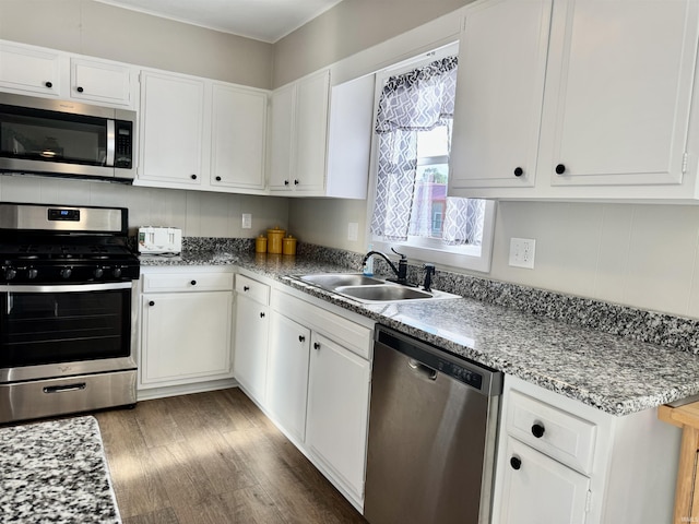 1719 Linwood Dr, Bedford, IN 47421 - kitchen with stainless steel appliances, a sink, and white cabinetry