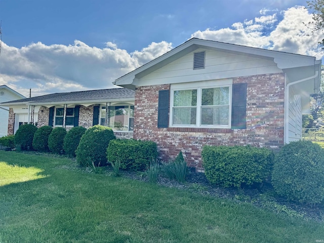 1719 Linwood Dr, Bedford, IN 47421 - ranch-style home with a front yard, an attached garage, and brick siding