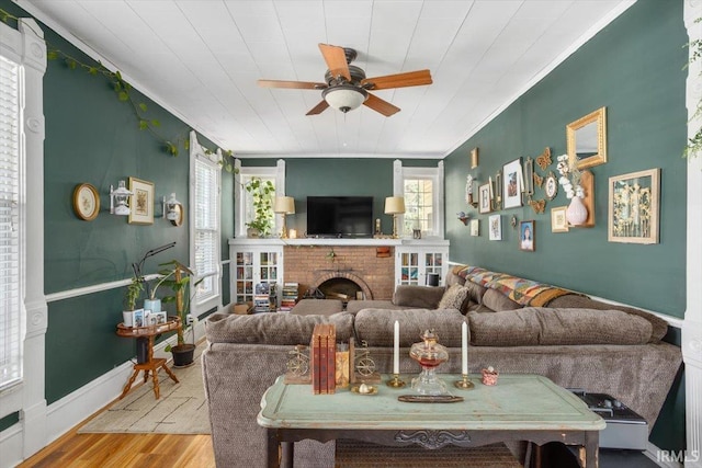 400 S Clay St, Frankfort, IN 46041 - living area featuring ornamental molding, wood finished floors, ceiling fan, and a fireplace