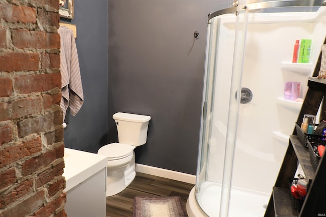 1008 E Walnut St, Petersburg, IN 47567 - full bath with a stall shower, wood finished floors, toilet, and baseboards