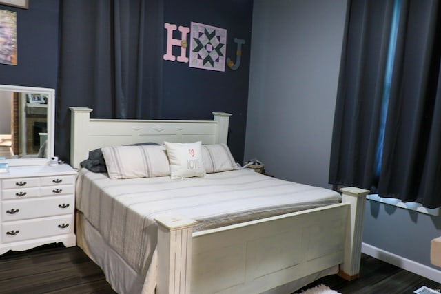 1008 E Walnut St, Petersburg, IN 47567 - bedroom featuring dark wood-style flooring and baseboards