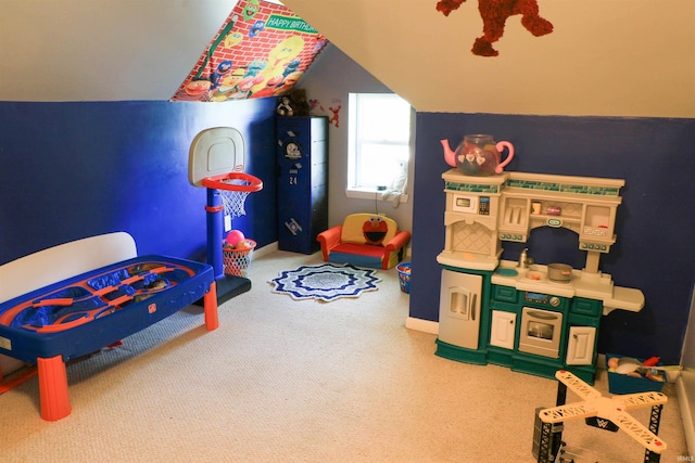 1008 E Walnut St, Petersburg, IN 47567 - rec room featuring vaulted ceiling, carpet, and baseboards