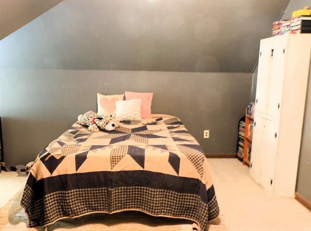 1008 E Walnut St, Petersburg, IN 47567 - carpeted bedroom with lofted ceiling and baseboards