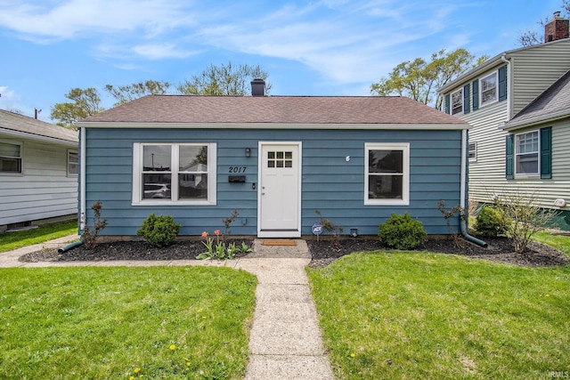 2017 Delaware St, Mishawaka, IN 46544 - bungalow-style home featuring a front yard and a shingled roof