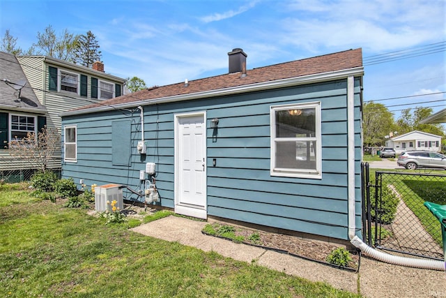 2017 Delaware St, Mishawaka, IN 46544 - rear view of house featuring a chimney and central air condition unit