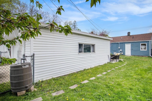 2017 Delaware St, Mishawaka, IN 46544 - view of side of home featuring a yard and cooling unit