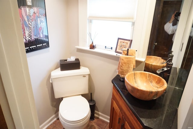 1208 Leeper Ave, South Bend, IN 46617 - bathroom with baseboards, vanity, and toilet