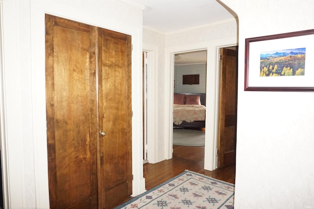 1208 Leeper Ave, South Bend, IN 46617 - hallway with wood finished floors, arched walkways, and crown molding