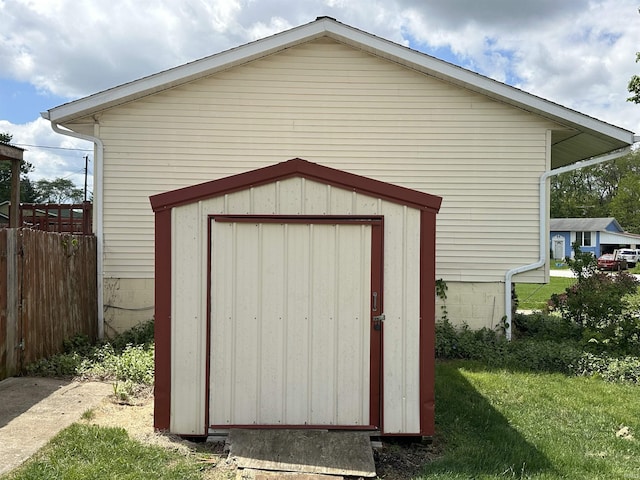 view of shed featuring fence