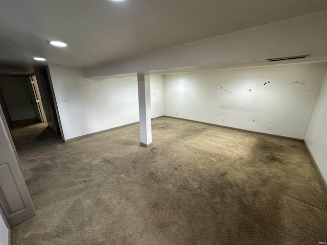 finished basement featuring carpet floors and baseboards