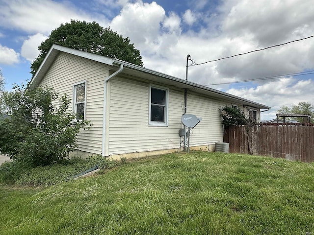 view of side of property featuring central AC unit