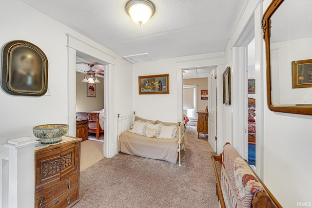 carpeted bedroom featuring attic access