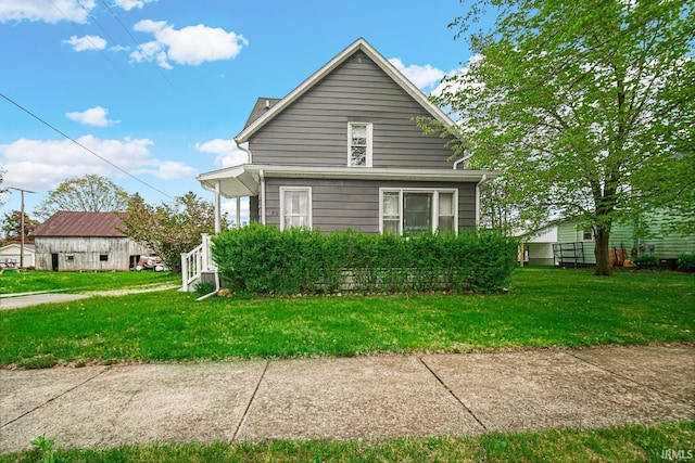 view of side of property featuring a yard