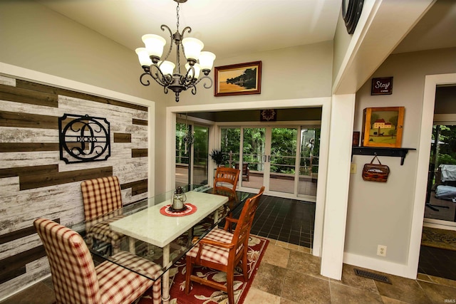 8209 Berry Dr, Evansville, IN 47710 - dining area with plenty of natural light, a chandelier, baseboards, and stone finish flooring