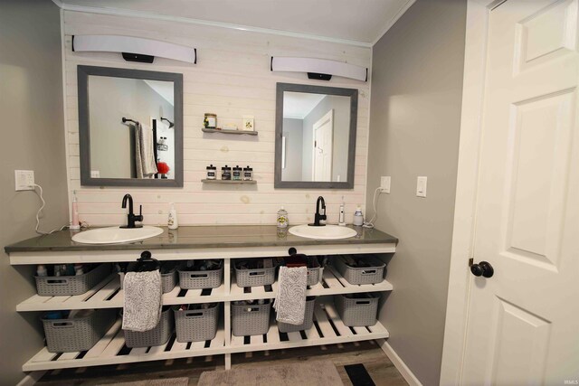 8209 Berry Dr, Evansville, IN 47710 - full bath with ornamental molding, baseboards, double vanity, and wood finished floors