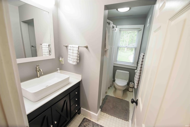 8209 Berry Dr, Evansville, IN 47710 - bathroom featuring toilet, vanity, baseboards, and tile patterned floors