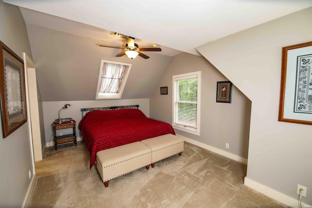 8209 Berry Dr, Evansville, IN 47710 - bedroom featuring baseboards, light carpet, lofted ceiling, and a ceiling fan