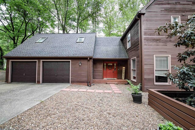 8209 Berry Dr, Evansville, IN 47710 - view of front of house with a shingled roof, concrete driveway, and an attached garage