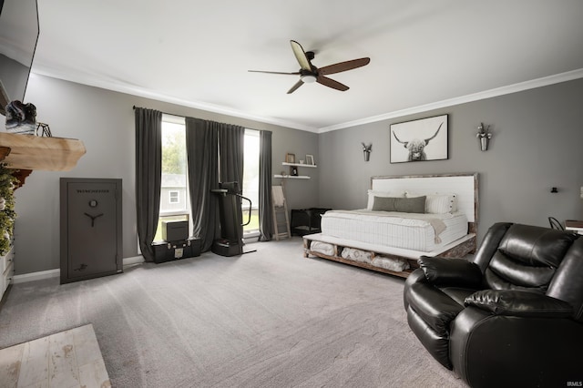 bedroom featuring crown molding, carpet flooring, ceiling fan, and baseboards