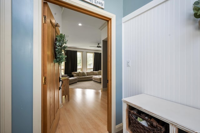 mudroom featuring light wood-style flooring, ceiling fan, and baseboards