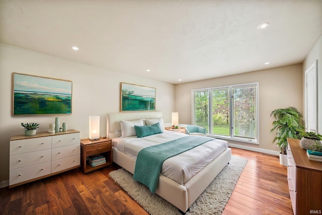 51167 Huntington Ln, Granger, IN 46530 - bedroom featuring wood finished floors, baseboards, and recessed lighting