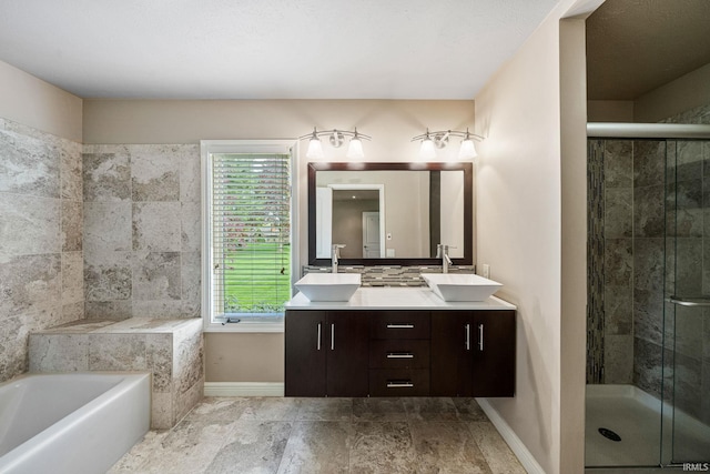 51167 Huntington Ln, Granger, IN 46530 - full bathroom featuring baseboards, a shower stall, double vanity, and a bath