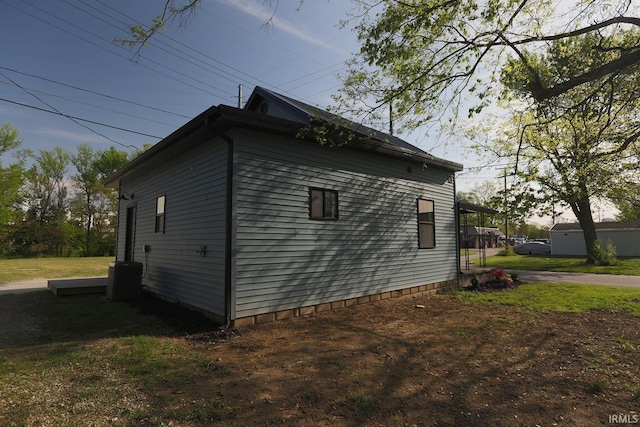view of side of home featuring central air condition unit
